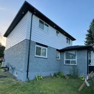 Grey Brick Stained House After