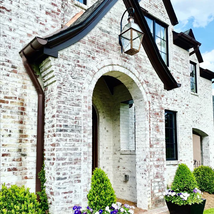European limewash brick home exterior